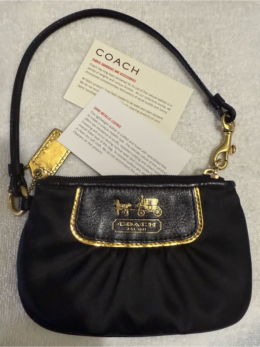 Coach Black Wristlet with Gold Accents - Picture 1 of 3